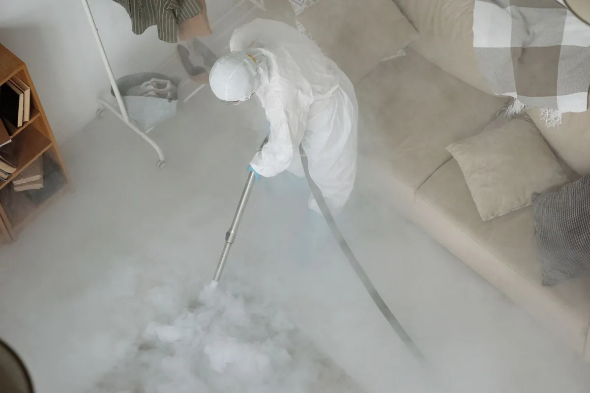 Biohazard cleanup technician in protective equipment, Mayfield, OH